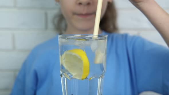 Girl with lemon water. 