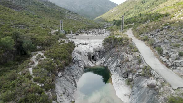 Flying backwards from dam, beautiful landscape, emerald water pools, 7 lagoons Trail