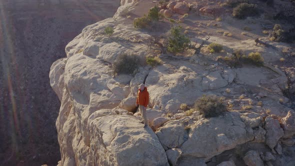 Aerial shot of a hiker at the the edge of Cedar Mesa in Utah