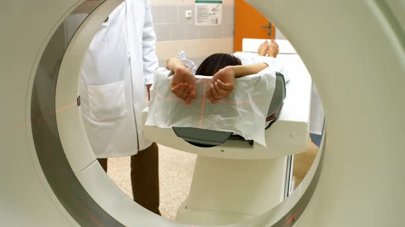 A patient is loaded into an mri machine