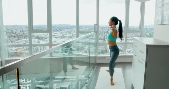 Woman performing stretching exercise at home 4k