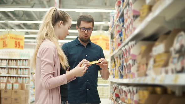 Young Family Buying Pet Food in Supermarket