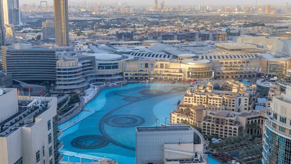 Evening Aerial View Dancing Fountains Downtown and in a Manmade Lake Timelapse in Dubai UAE