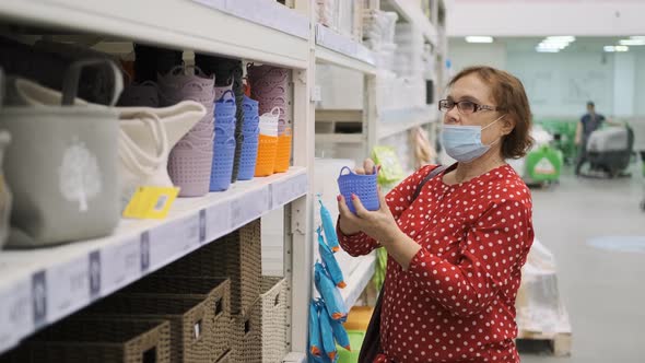 Senior Woman Choosing Storage Basket in a Store