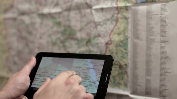 Preparing for the Tourist Trip Using a the Tablet and Map