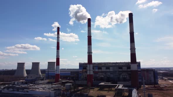 Timelapse aerial view of a working soaring heat power station at an industrial zone.