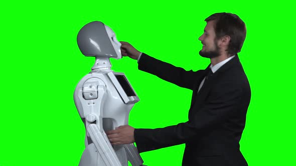 Man Hugging a Robot . Green Screen. Slow Motion