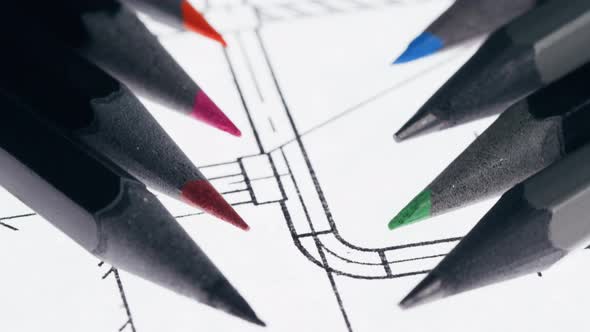 Colorful Pencils on Plan Blueprint Closeup