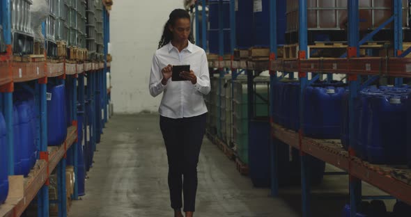 Young female manager worker in a warehouse