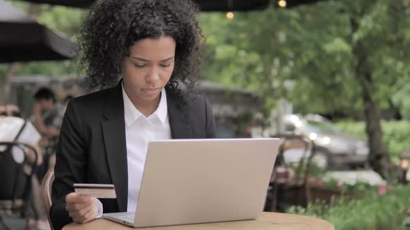 Successful Online Shopping By Young Woman Sitting on Bench