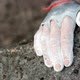Closeup of a Rock Climber's Hands in Chalk Grabbing a Rock Ledge - VideoHive Item for Sale