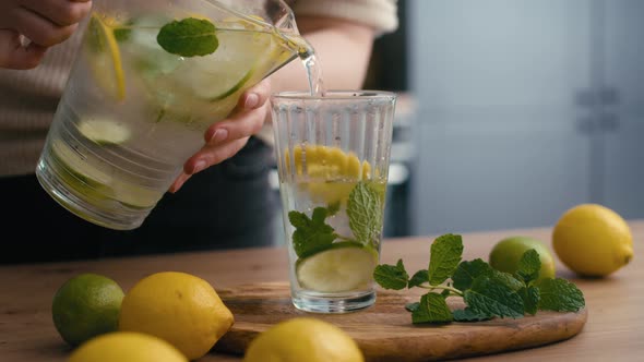 Close up of woman making lemonade in the kitchen. Shot with RED helium camera in 4K.