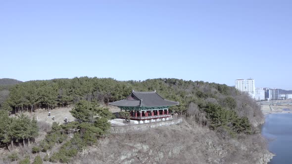 Areial Sweeping View Of Korean Gazebo In Winter