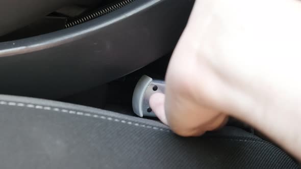 Disconnecting booster seat  from car brackets 4k footage