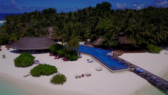 Aerial drone tourism of paradise shore beach vacation by aqua blue sea with bright sandy background 
