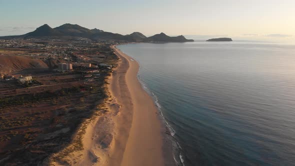 Aerial panoramic view of Matadouro beach in Portugal at sunset