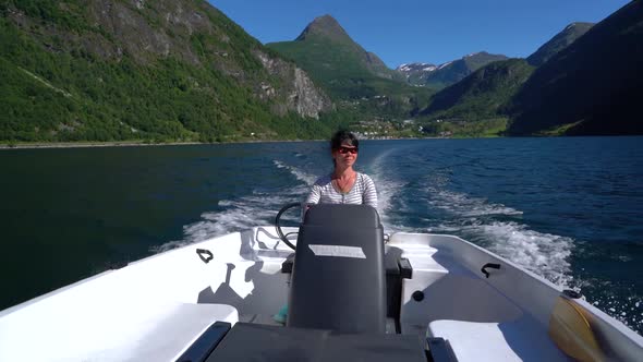 Woman Driving a Motor Boat