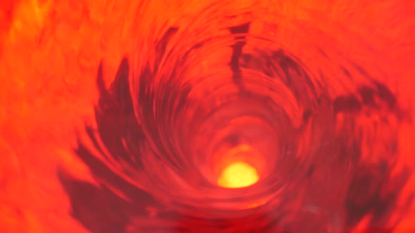 Symbol of Hell, Inferno and Infinity. Red Liquid Hypnotic Aqua Swirl Turning. Meditative Ruby