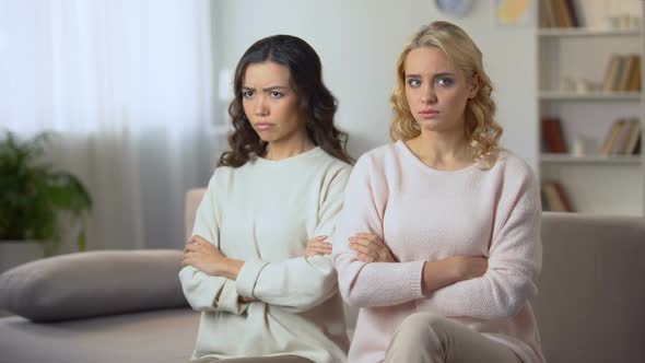 Young Woman Hugging and Reconciling With Female Friend After Quarrel, Indoors