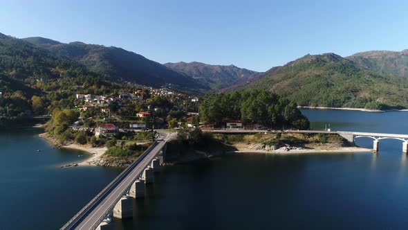 Aerial View on Bridge Over River Cávado with Mountains in the Background