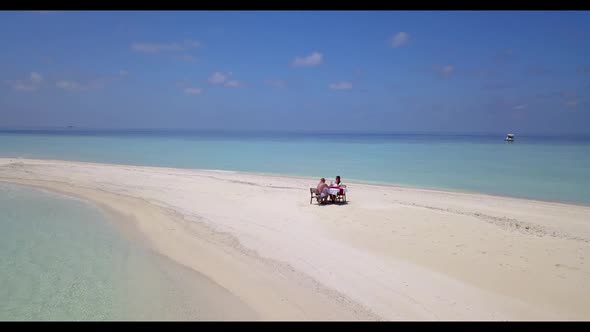 Teenage lovers happy together on idyllic shore beach lifestyle by blue lagoon and white sandy backgr