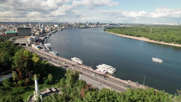 Aerial View of Metropolis By River with Skyscrapers Highway and Car Traffic