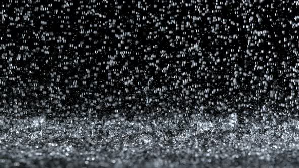 Super Slow Motion Shot of Heavy Rain Isolated on Black Background at 1000Fps