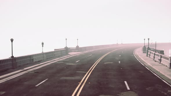 Old Empty Stone Bridge on a Foggy Day