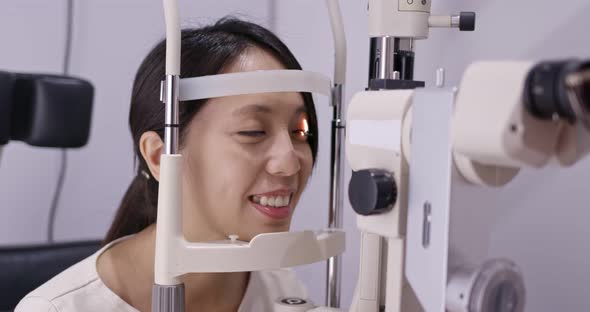 Woman check on eye inside clinic