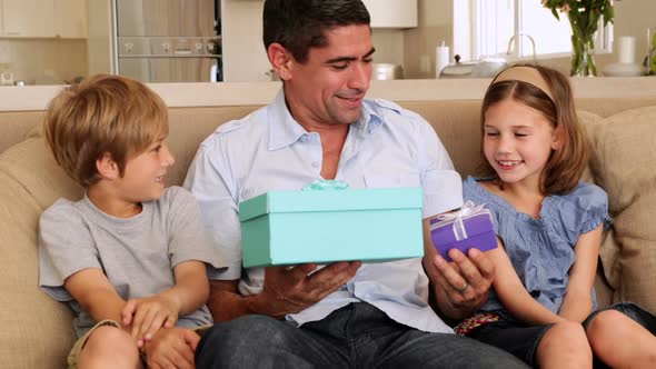 Cute Children Giving Their Father Presents