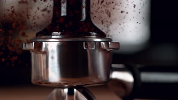 Super Slow Motion Shot of Tamping Fresh Ground Coffee at 1000Fps