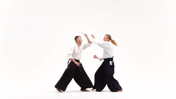 Two Athletes Showing Aikido Using Tanto