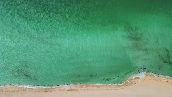 Aerial View of Clear Turquoise Sea and Waves