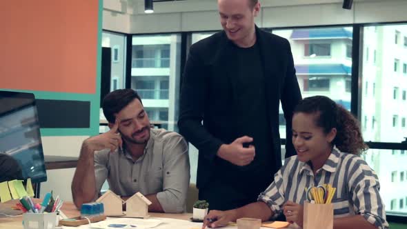 Creative Business People Group Having Conversation at Office Desk in Workplace