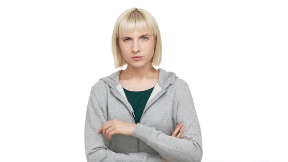 Portrait of Persistent Female Blondie with Bob Haircut in Casual Clothes Looking at Camera with