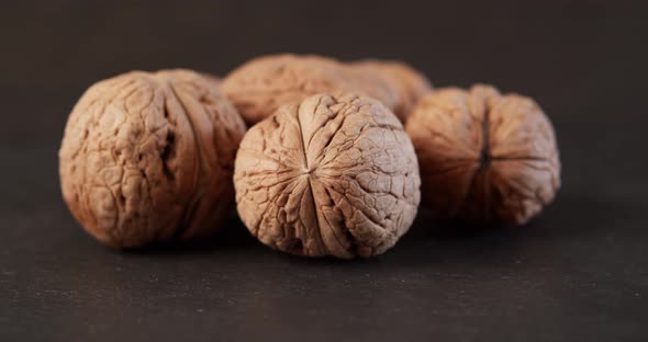 Delicious and Fresh Walnuts on a Black Stone Table