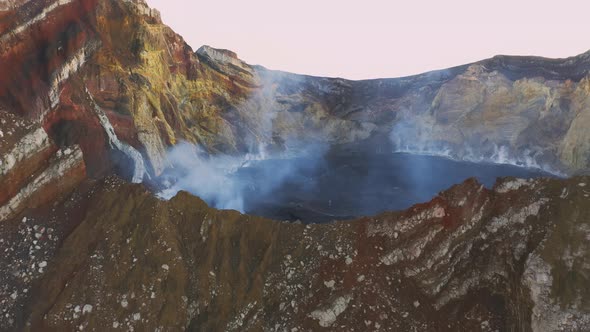 Drone View of Volcano Crater Smoking in Tropical Island