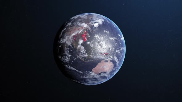 Animation of the planet earth spinning around and changing colors in a blue dark background alt