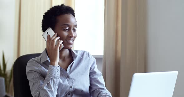 Serious Attractive African American Business Woman Student Girl Freelancer Talking on Phone