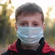 Portrait of Little Boy Wearing Medical Mask on Autumn Park - VideoHive Item for Sale
