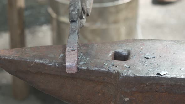 Blacksmith Forges Metal With A Hammer
