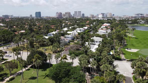 Gorgeous aerial of Palm Beach, Florida downtown with the uber-wealthy suburbs and splendid golf cour