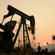 pumpjack at an oil drilling site and sunset - VideoHive Item for Sale