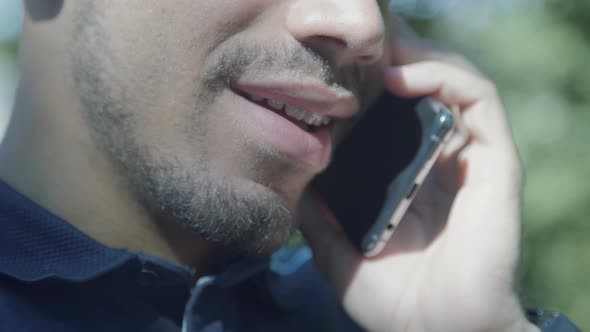 Close Up Shot of Male Caucasian Mouth Talking on Phone