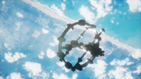 A View of the Earth and a Spaceship. ISS Is Orbiting the Earth alt