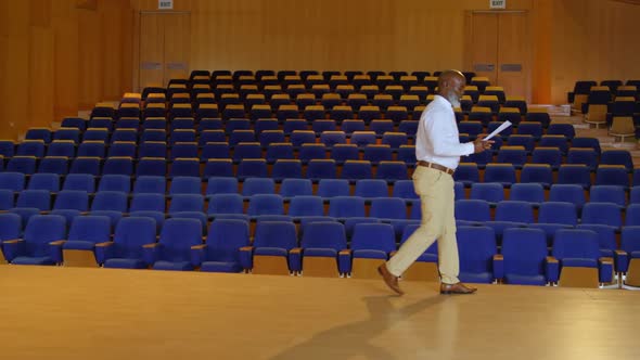 African American businessman practicing speech in empty auditorium 4k