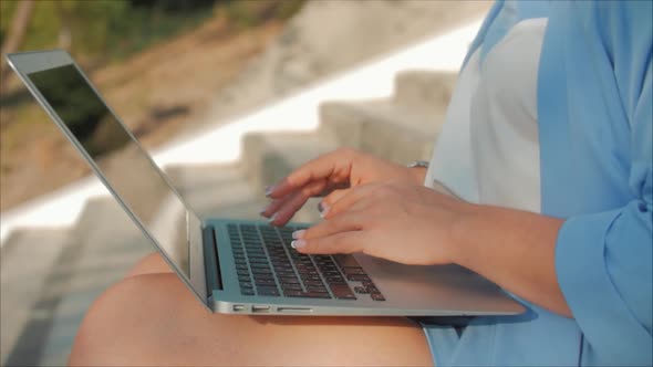 Business Lady Working on the Laptop, Attractive Brunette in a Blue Suit With a Laptop, Attractive