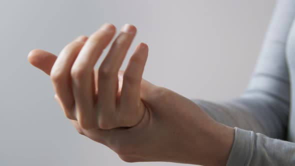 Close Up of Woman Spraying Hand Sanitizer