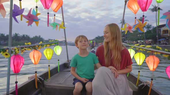 A Young Woman and Her Son Tourists Visit an Ancient Town of Hoi An in the Central Part of Vietnam