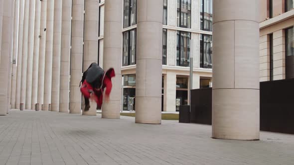 Man Practicing Parkour Stunts Outdoors in the City